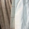 Ivory Herringbone/tweed curtains with a red check design - Image 3