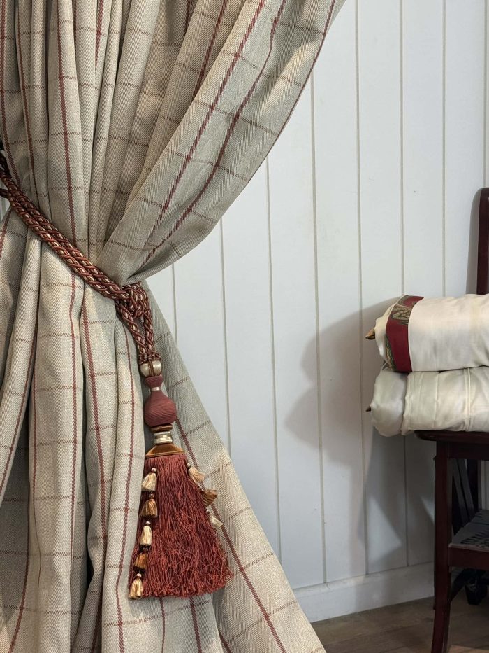 Ivory Herringbone/tweed curtains with a red check design