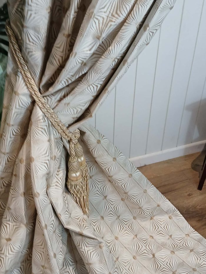 Geometric ivory curtains with embroidered gold details