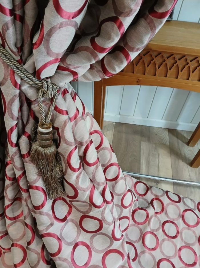 Retro, circular red curtains with fleece and blackout lining.