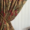 Rich claret red curtains in a paisley design